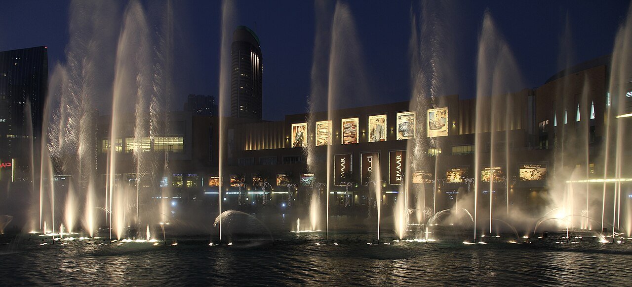 Dubai Fountain show at dusk with Burj Khalifa