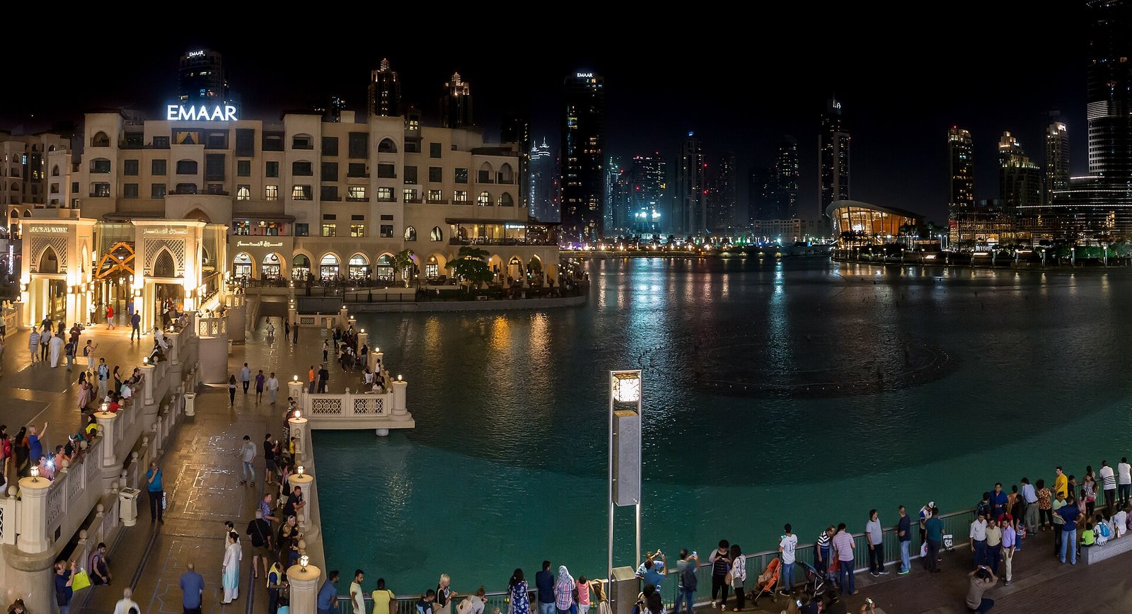 Downtown Dubai at night, with the fountain lake and the lit skyline outside The Dubai Mall