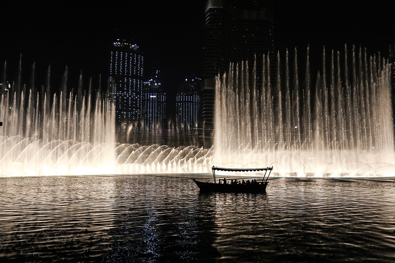 Abra boat on Burj Lake at night