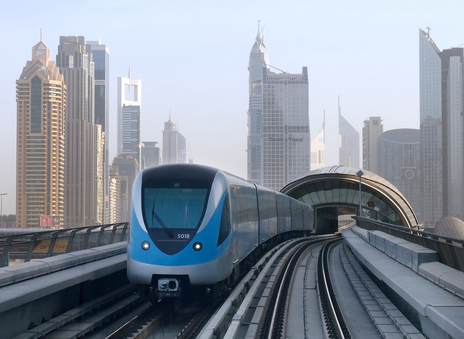 Dubai Metro train on the Red Line with city towers behind
