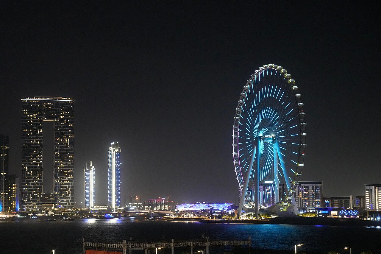 Ain Dubai at sunset with its light show over Bluewaters Island